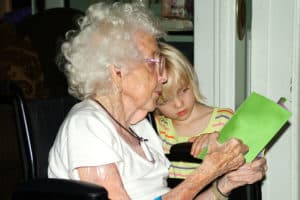 reading-with-grandmother-in-wheelchair