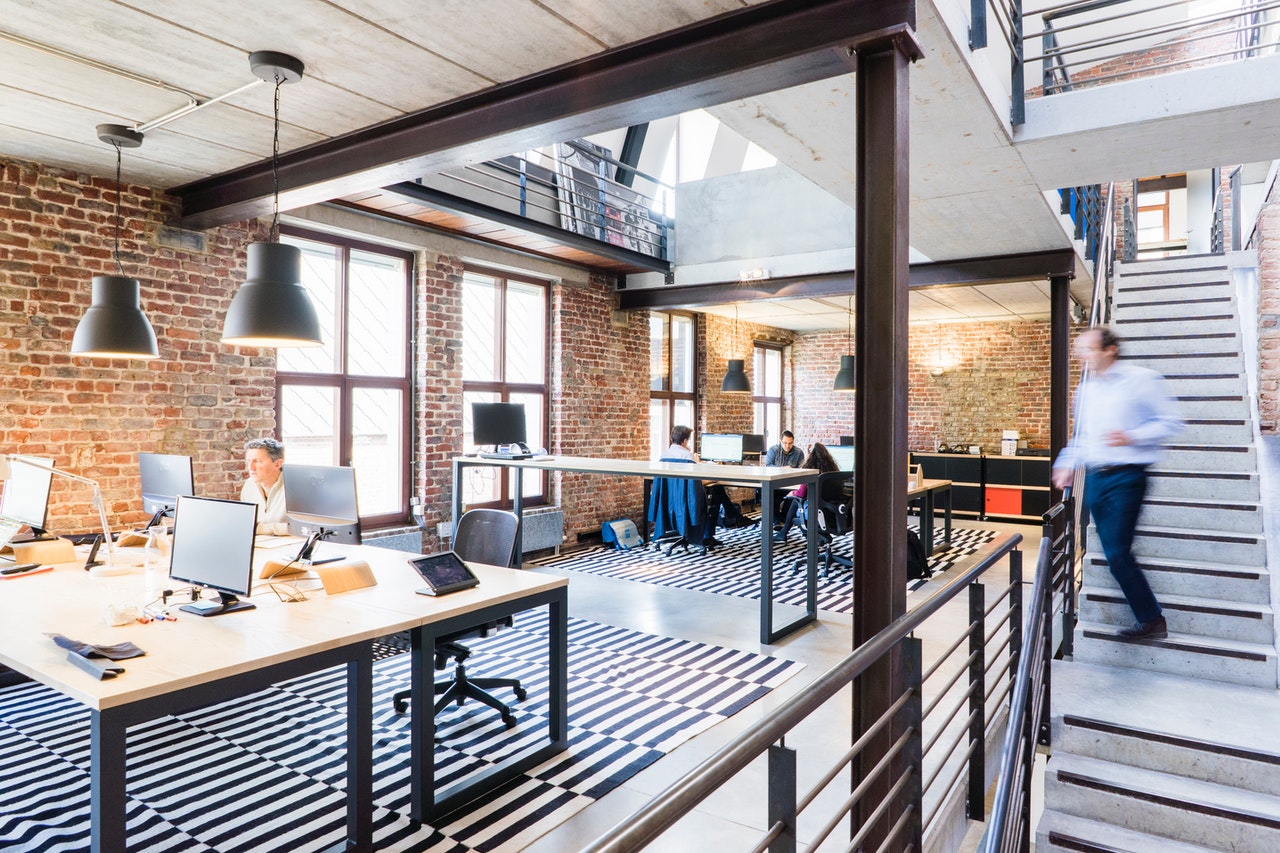 Clean modern office space with exposed brick walls